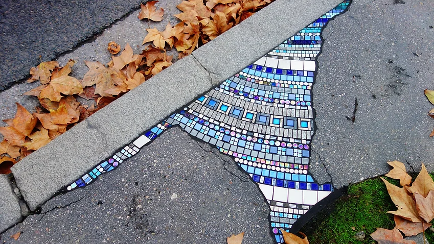 French Artist Fills Potholes Across Europe with Mosaics